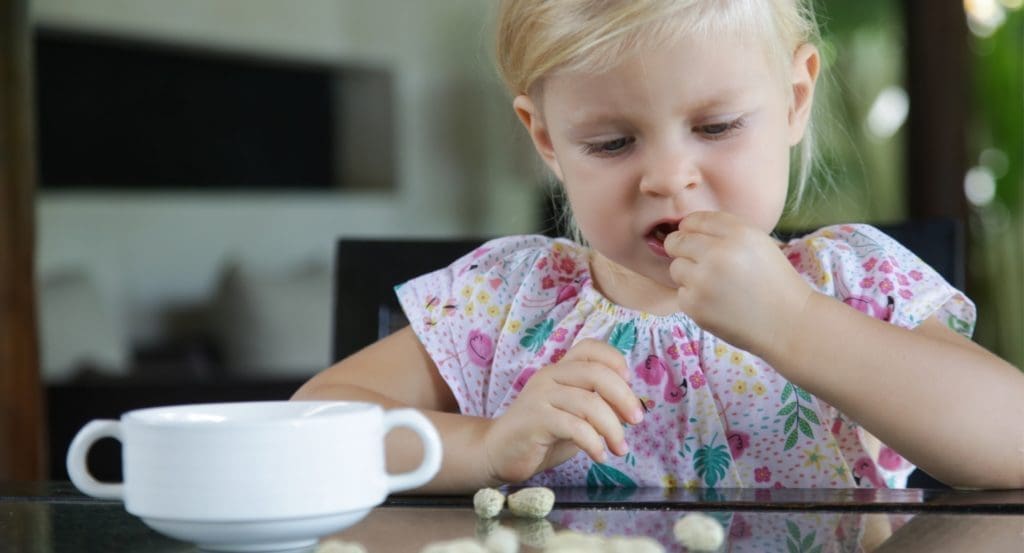 child eating nuts